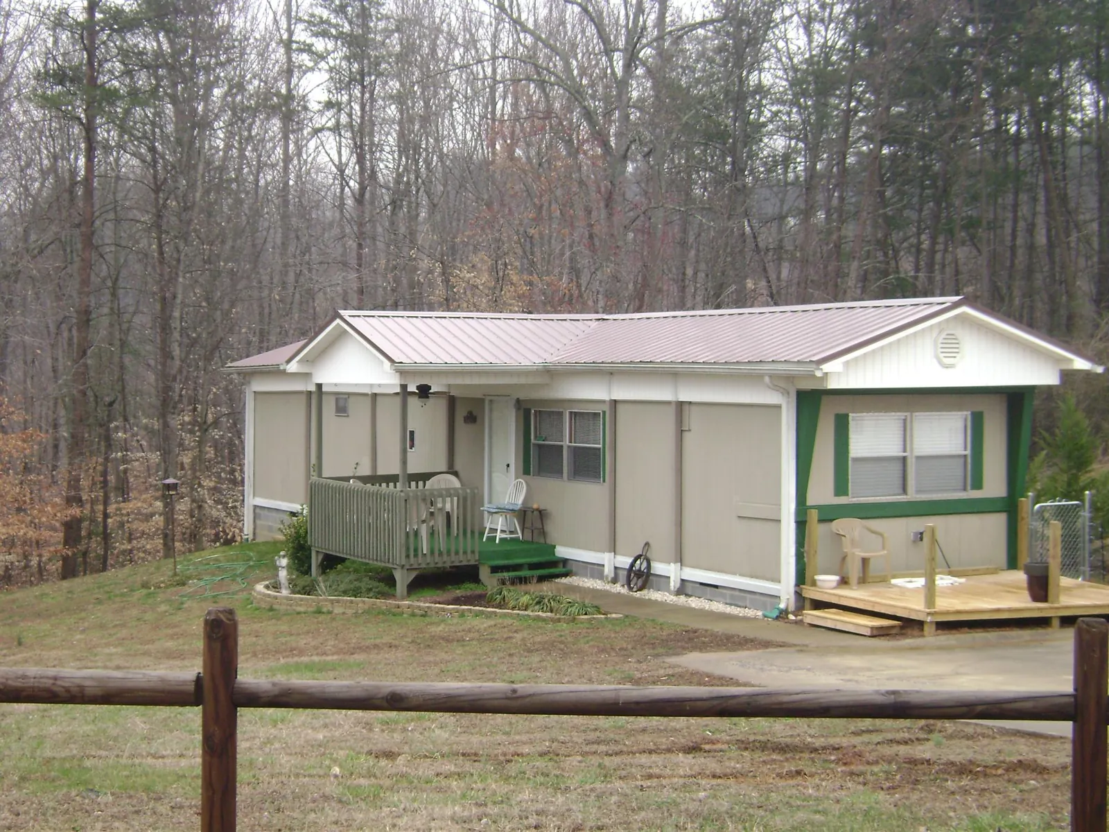 Mauve metal roof on a manufactured home with a new front deck in Reading